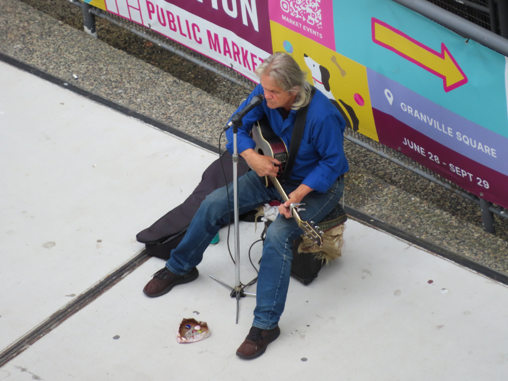 A busker far below, seen from Room 916 at the Fairmont Waterfront Hotel in Vancouver.