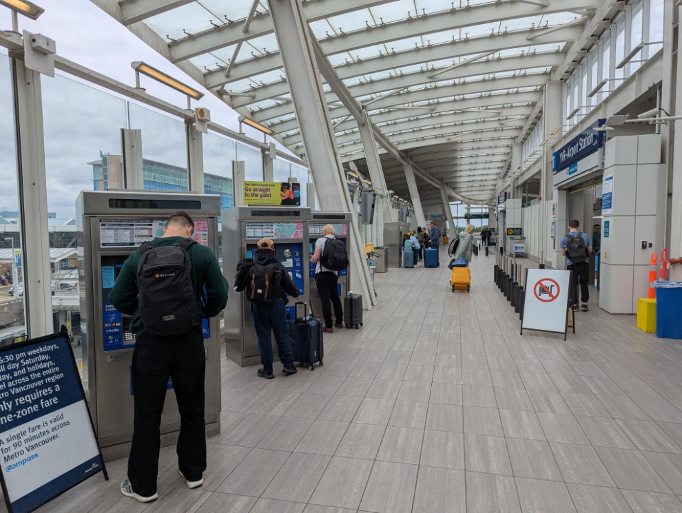 Getting tickets from the machines at the Canada Line station at Vancouver International Airport (YVR).
