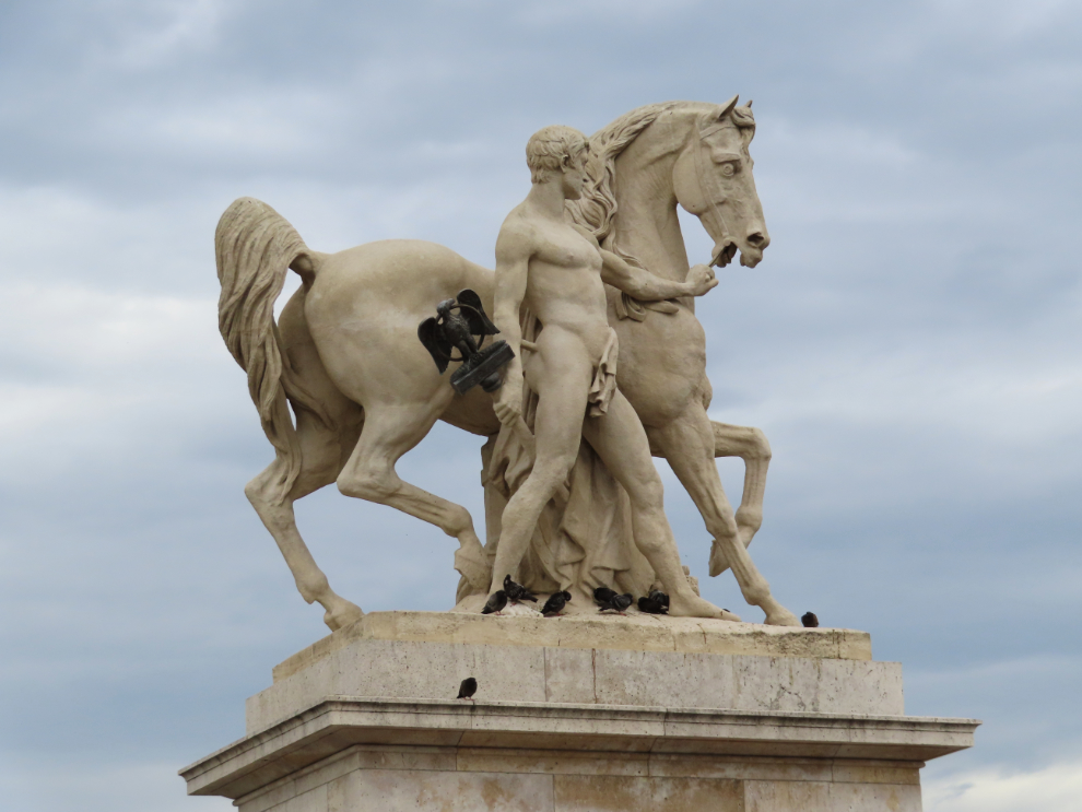 A statue of a naked man and his horse, at the Pont d'Iena in Paris.