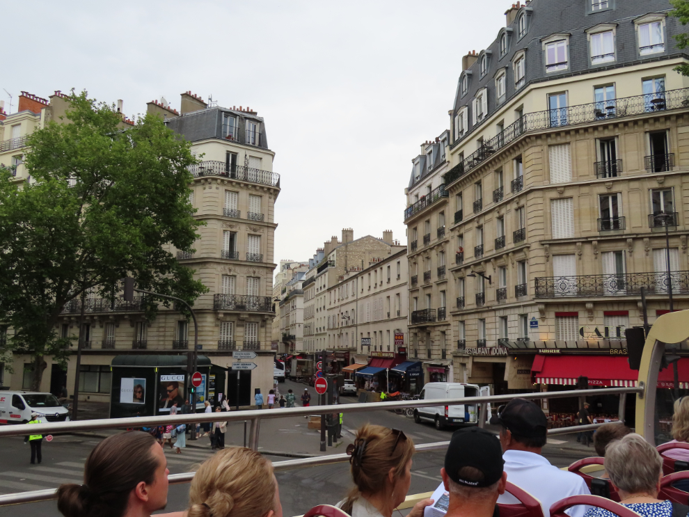 Touring Paris by open-top bus.