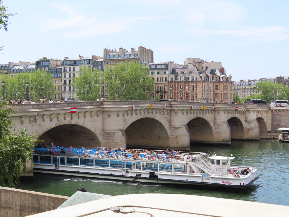 Touring Paris by open-top bus: the Pont Neuf (New Bridge), the oldest standing bridge across the Seine in Paris.