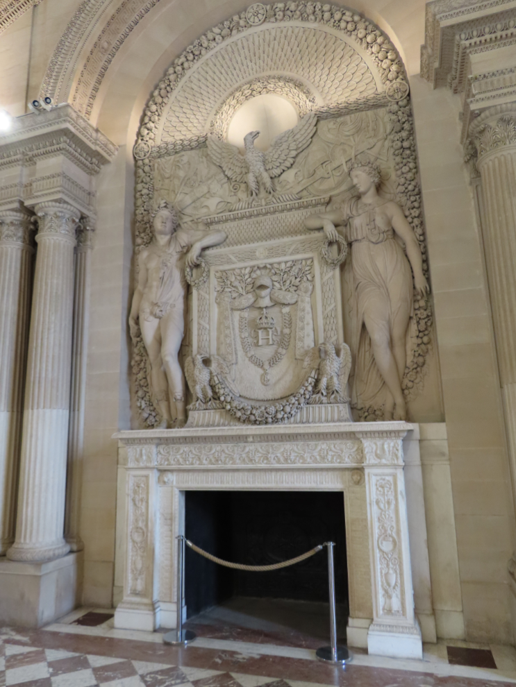 A magnificent fireplace at the Louvre Museum in Paris.