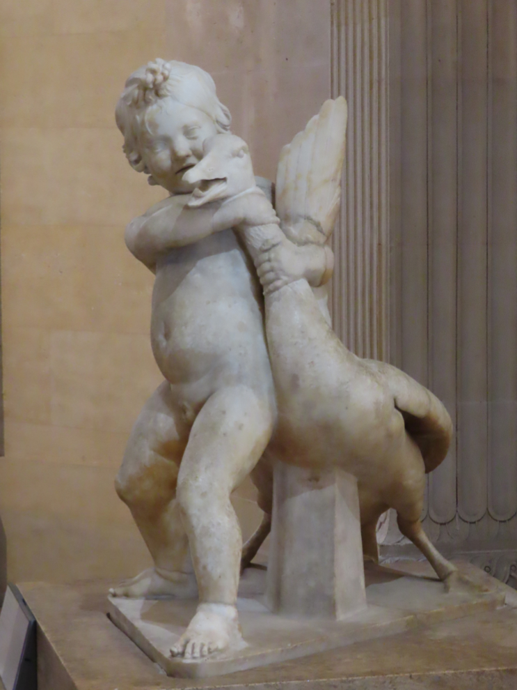 A statue of a boy and goose, at the Louvre Museum in Paris.