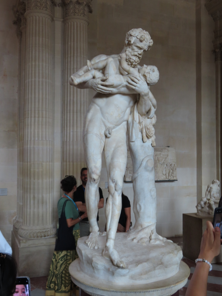 A statue of Silenus with infant Dionysus, at the Louvre Museum in Paris.