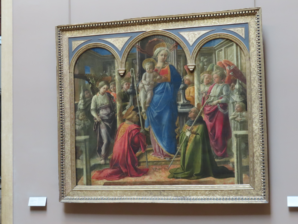 The Barbadori Altarpiece by Filippo Lippi, 1438 - 'Virgin and Child Surrounded by Angels with St. Frediano and St. Augustine,' at the Louvre Museum in Paris.