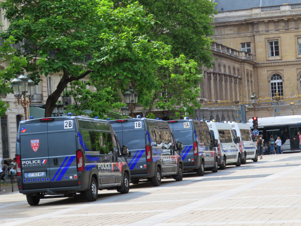 Police vans at the Palais de Justice in Paris.