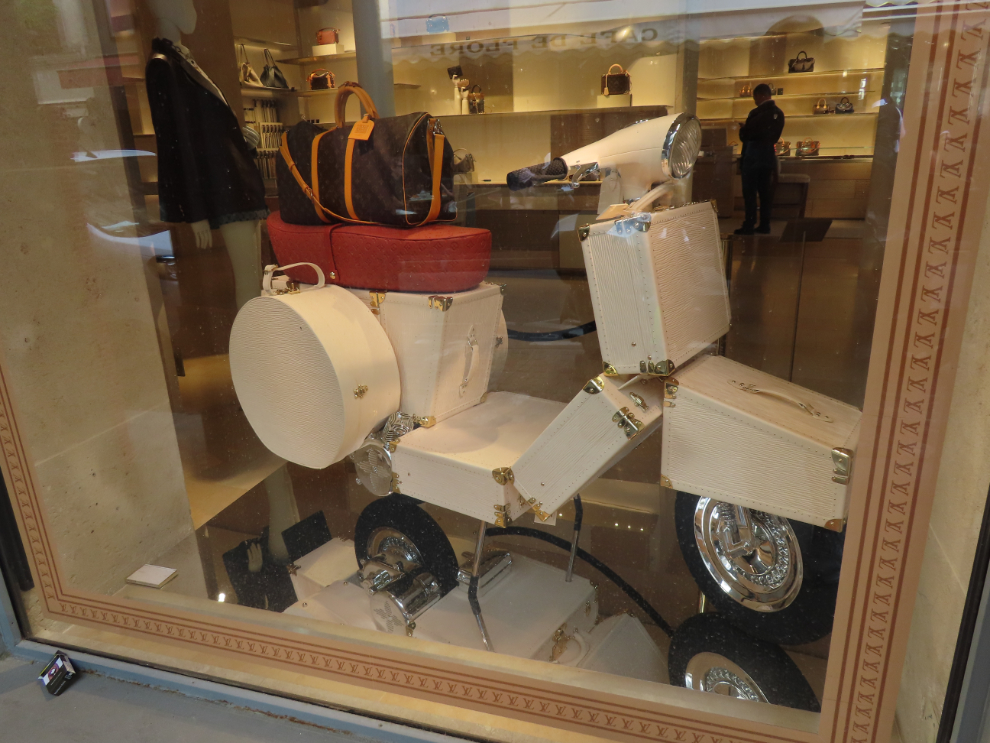 A motorcycle created with about $25,000 worth of Louis Vuitton luggage, in Saint-Germain-des-Pres district in Paris.