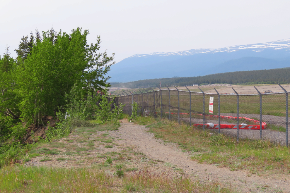 The end of the Whitehorse airport perimeter trail. A slide about 5 years ago came right up to the fence.