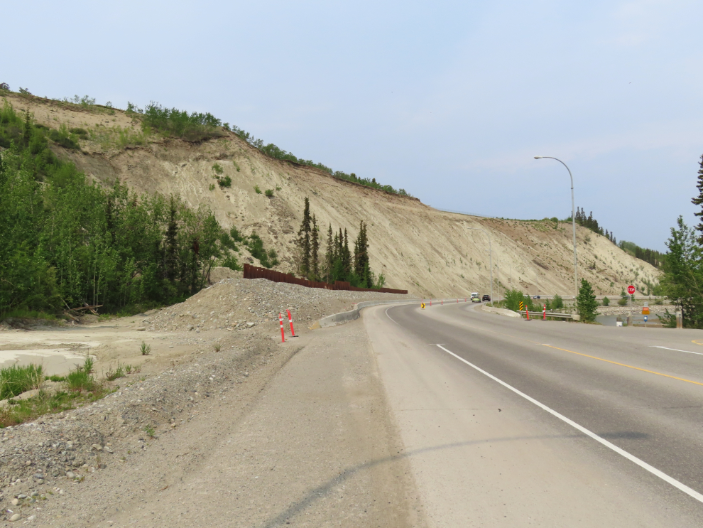 The metal sheet piling wall that was installed along Robert Service Way in 2022 as a slide barrier.