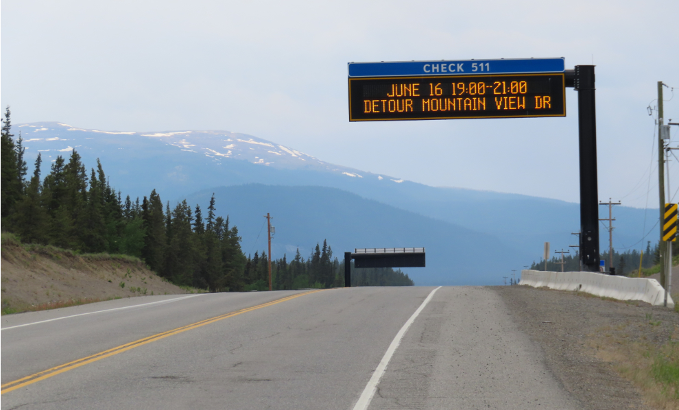 Highway conditions sign warns of an upcoming closure of the Alaska Highway.