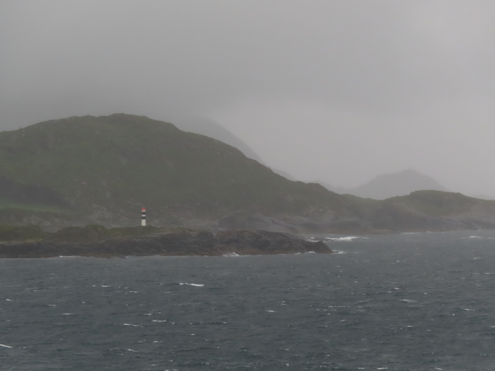 Passing a lighthouse as we sailed towards Aldalsnes, Norway, on a stormy morning.