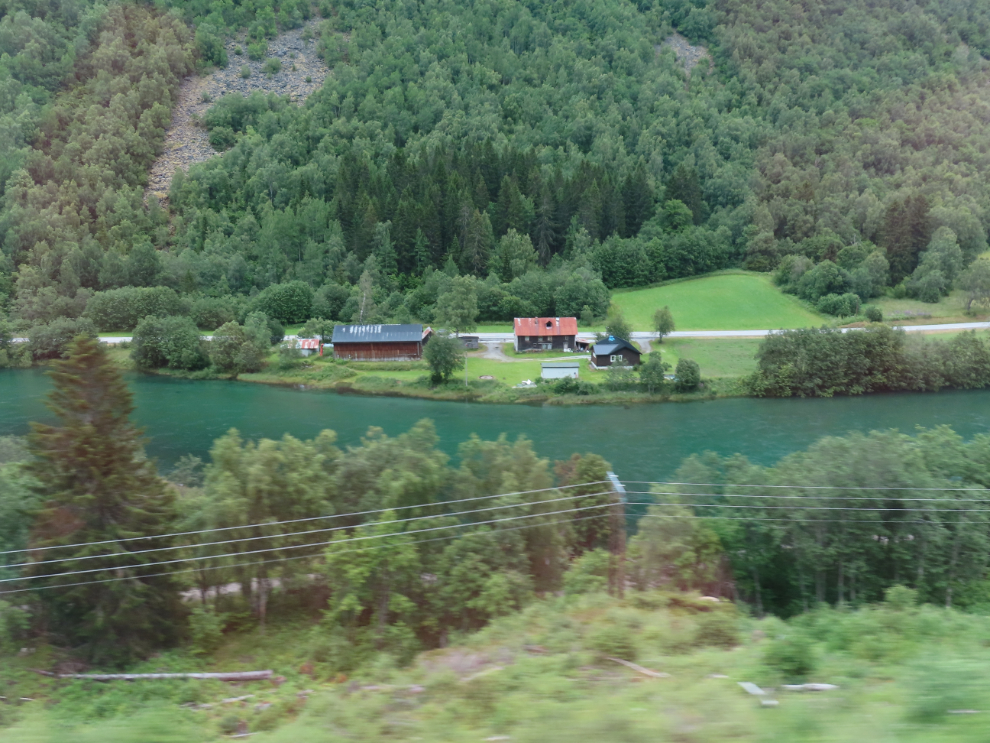 A riverside farm along the route of the Golden Train at Aldalsnes, Norway.