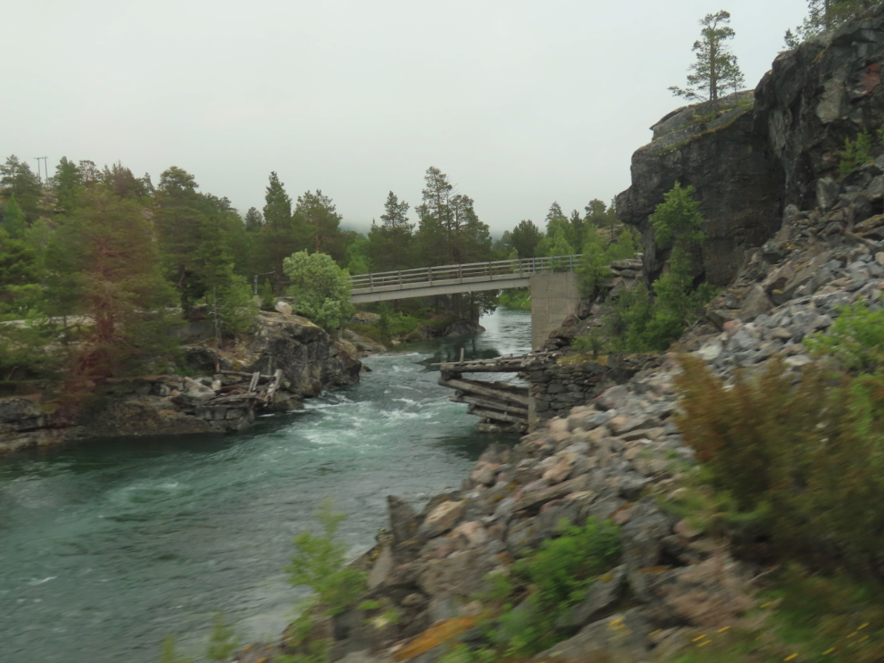 A river and bridges along the route of the Golden Train at Aldalsnes, Norway.
