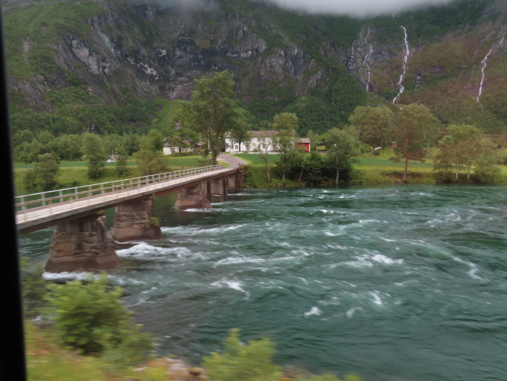 A riverside farm on the route of the Golden Train at Aldalsnes, Norway.
