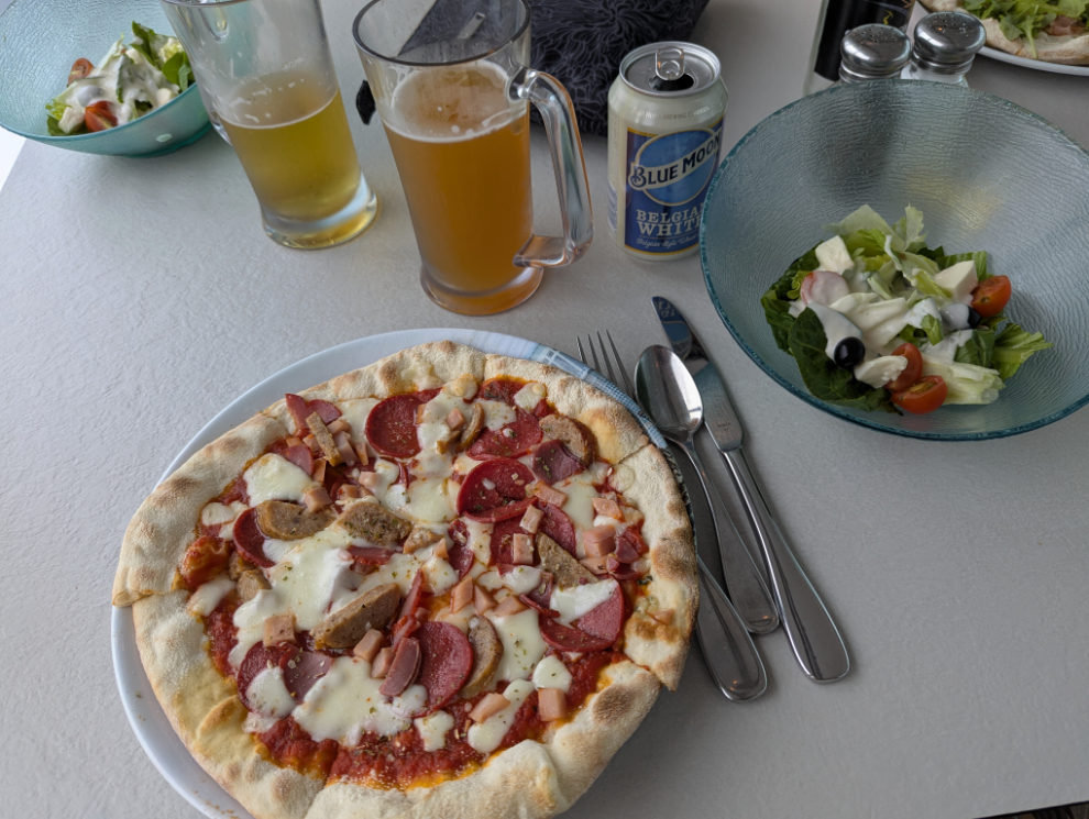 Pizza, salad, and beer for dinner on the Holland America cruise ship Nieuw Statendam.