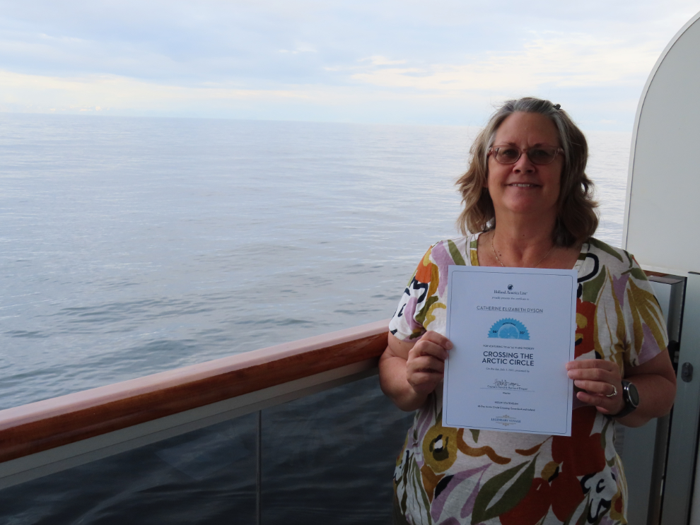 Cathy Dyson with her first 'Crossing the Arctic Circle' certificate, off the coat of Norway on the Holland America cruise ship Nieuw Statendam.