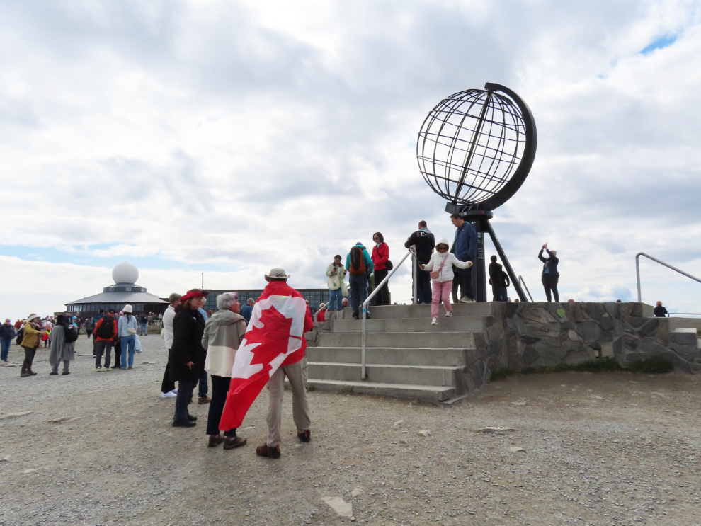 A Canadian among the crowd of tourists at the globe at Nordkapp (North Cape), Norway.