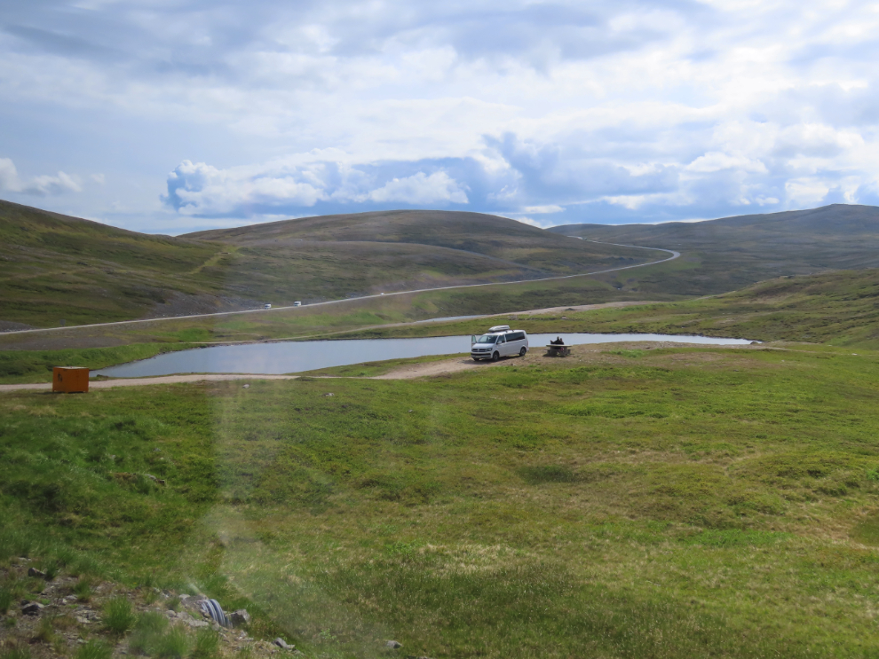 A campervan at a small lake on the 33-km drive from Nordkapp to Honningsvag, Norway.