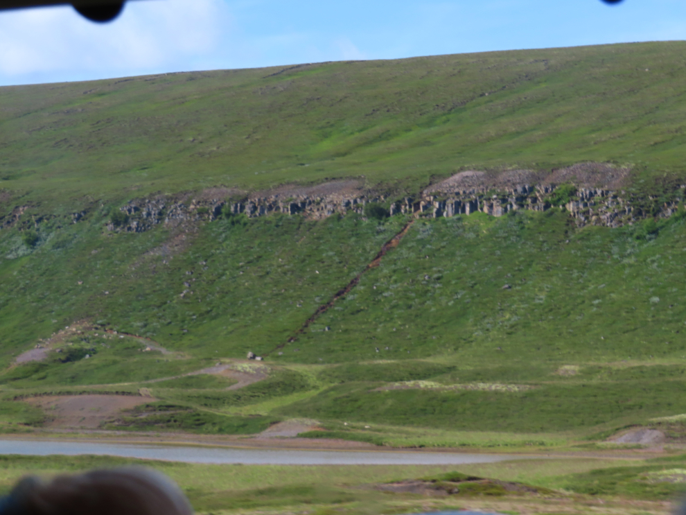 A wall of basalt in the little valley near Husavik, Iceland.