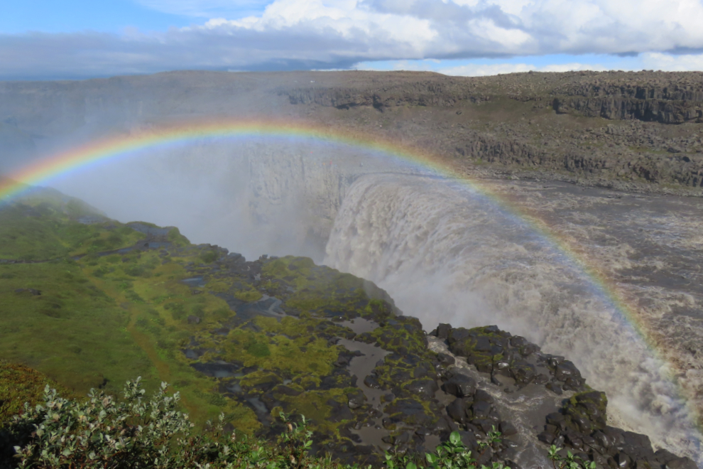 The waterfall Dettifoss, Iceland, with heavy mist and a rainbow.