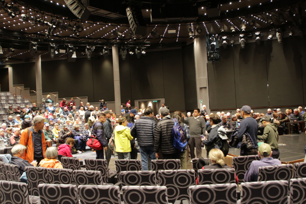 Gathering for an excursion at Husavik, Iceland, in the main theatre of the Holland America cruise ship Nieuw Statendam.