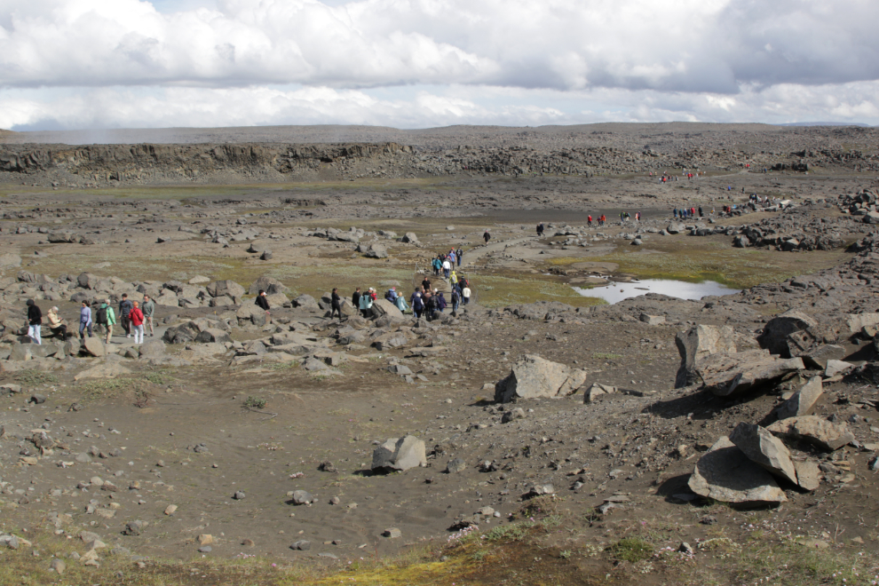 Walking to the waterfall Dettifoss, Iceland.