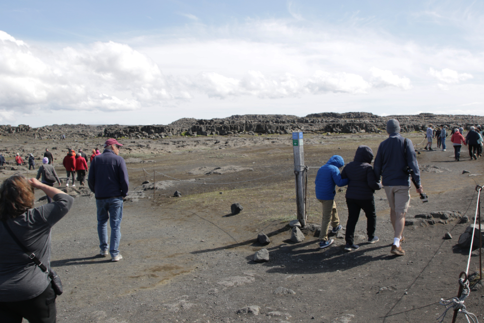Walking to the waterfall Dettifoss, Iceland.