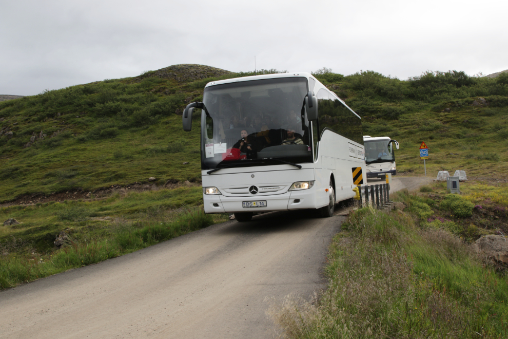 Tour busses arriving at the Dynjandi waterfall in Iceland.