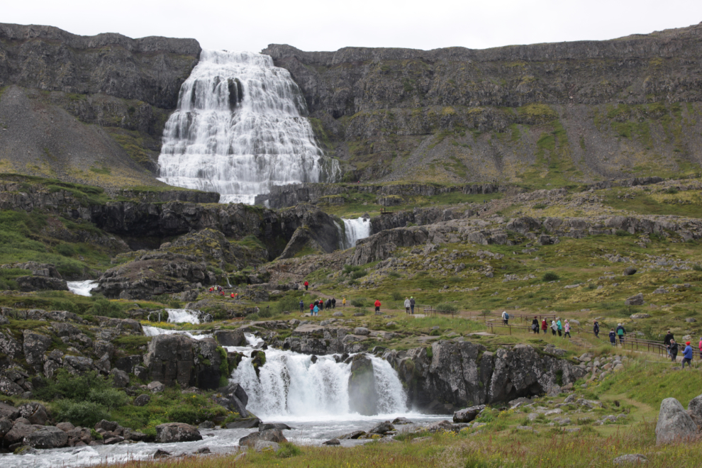 The huge upper waterfall is the Dynjandi waterfall in Iceland.