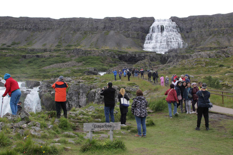The huge upper waterfall is the Dynjandi waterfall in Iceland.