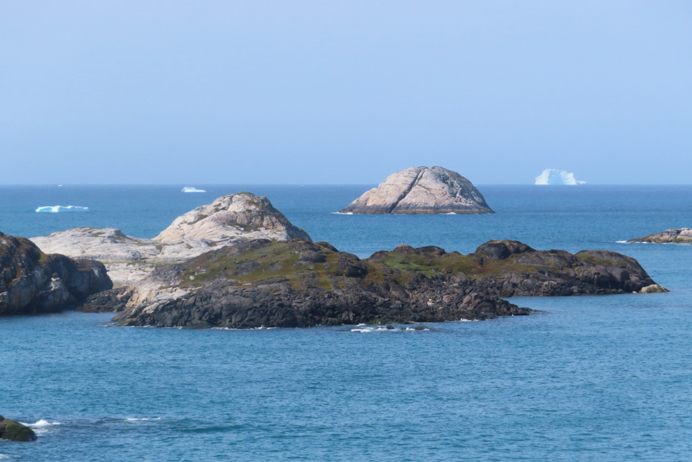 Rocky islands and icebergs near Paamiut, Greenland.
