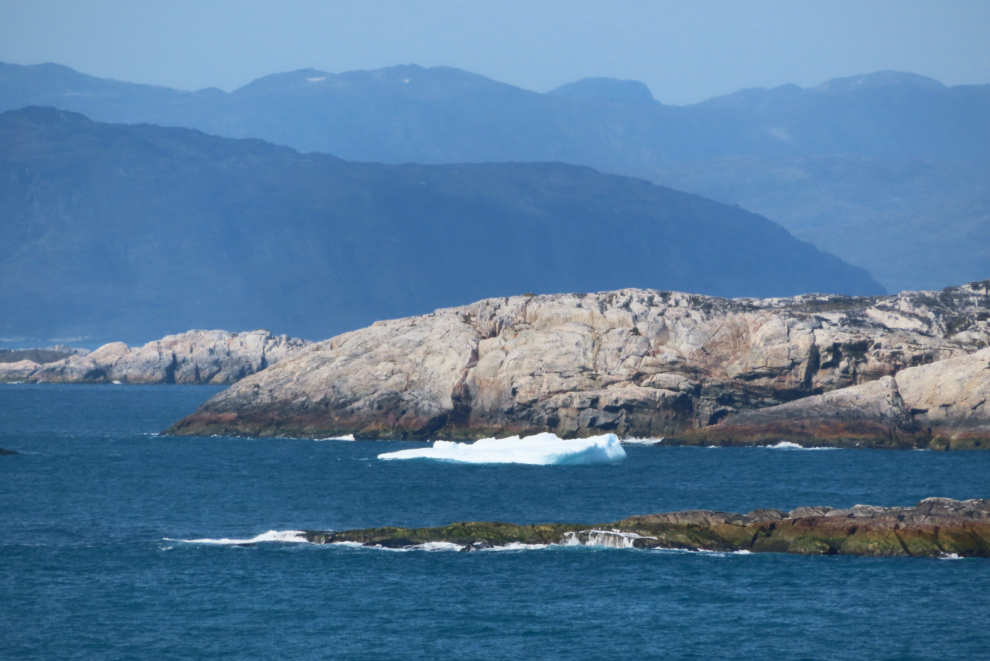 Rocky islands and icebergs near Paamiut, Greenland.