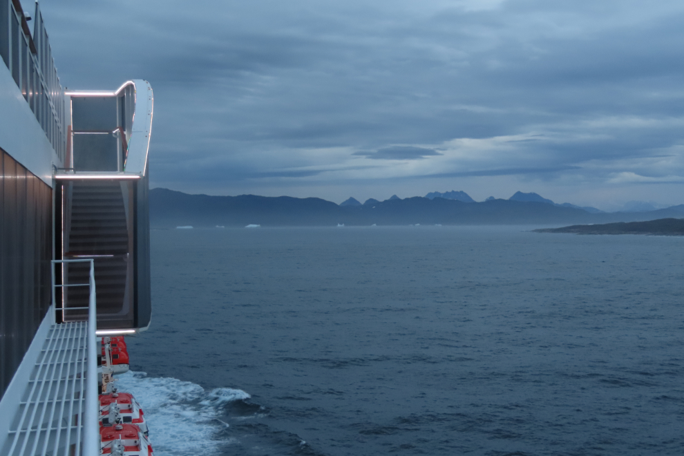 Approaching Qaqortoq, Greenland, on the Holland America cruise ship Nieuw Statendam, with icebergs ahead.