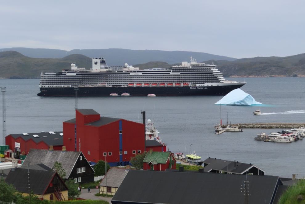 The Holland America cruise ship Nieuw Statendam at Qaqortoq, Greenland, with a huge iceberg.