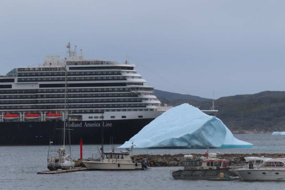 The Holland America cruise ship Nieuw Statendam at Qaqortoq, Greenland, with a huge iceberg.