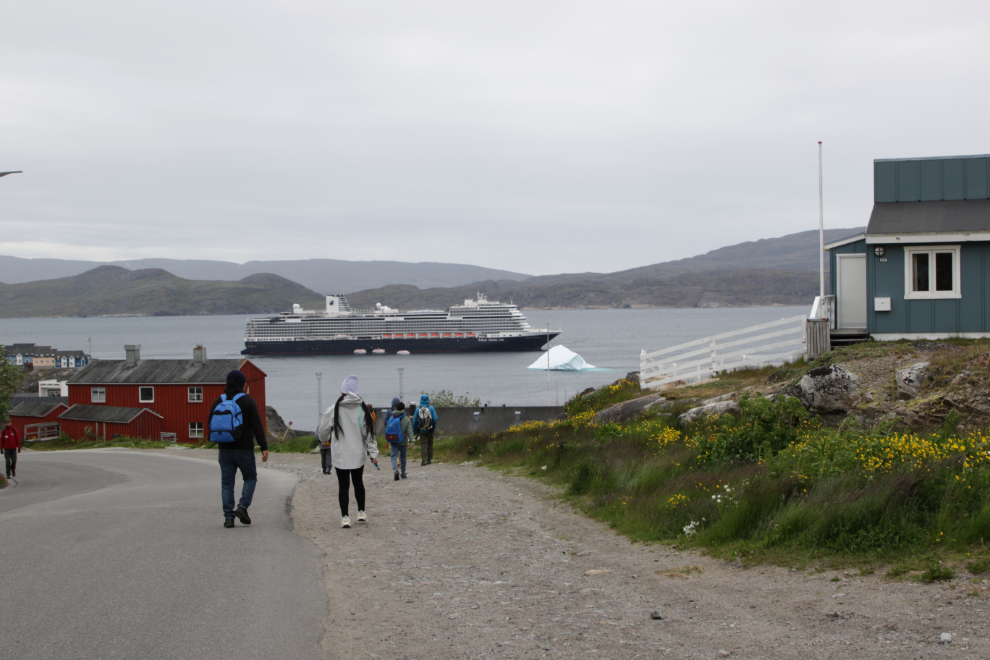 The Holland America cruise ship Nieuw Statendam at Qaqortoq, Greenland, with a huge iceberg.