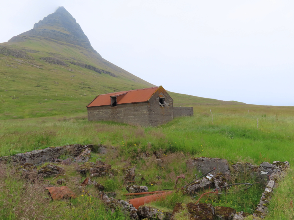 A concrete barn and ruins below Kirkjufell at Grundarfjordur, Iceland.