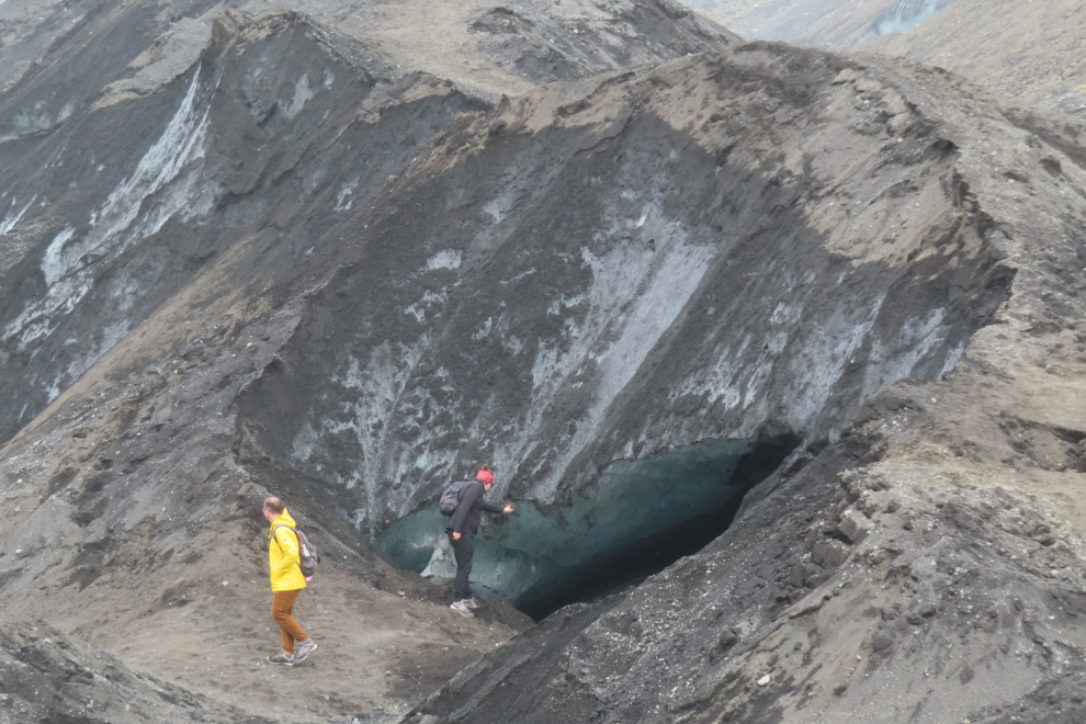 Touching the glacier Solheimajokull on Iceland's South Coast.