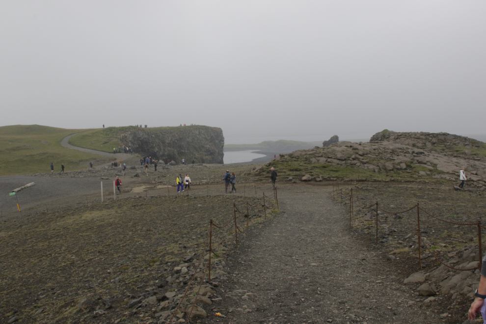 Dyrholaey on Iceland's South Coast, in heavy fog and volcanic smoke. 