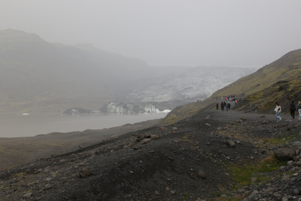 The glacier Solheimajokull, a tongue of the Myrdalsjokull icecap, on Iceland's South Coast, in heavy fog and volcanic smoke. 