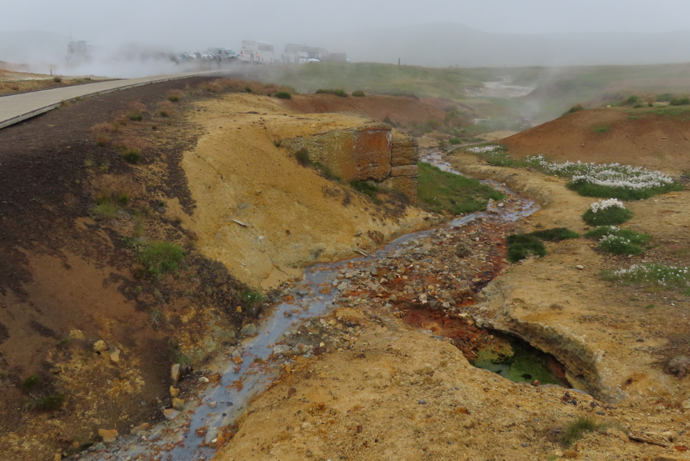 The Seltun Geothermal Area on the Reykjanes Peninsula, Iceland, with steam and heavy volcanic smoke.