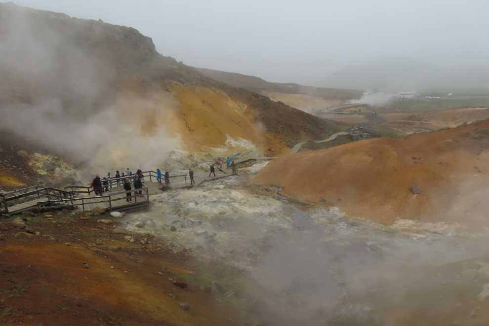 The Seltun Geothermal Area on the Reykjanes Peninsula, Iceland, with steam and heavy volcanic smoke.
