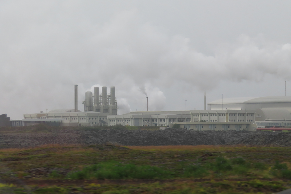 The massive The Svartsengi Geothermal Power Plant, Iceland, threatened by lava flows. Visibility obscured by heavy smoke from an ongoing eruption (July 2025).
