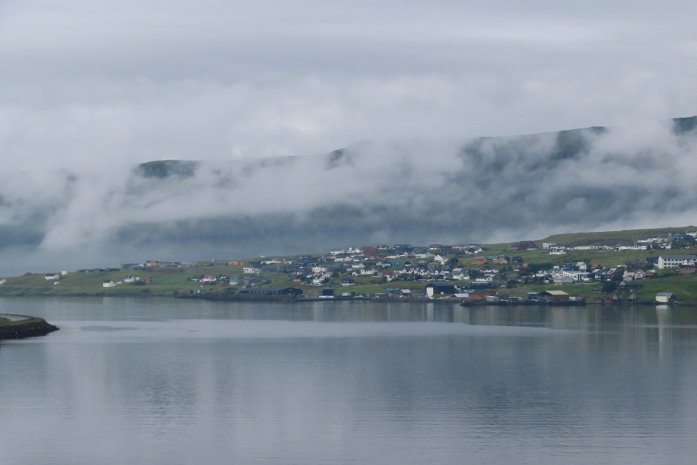 Fog breaking up at Runavik, Faroe Islands, seen from our cabin on the Holland America cruise ship Nieuw Statendam.