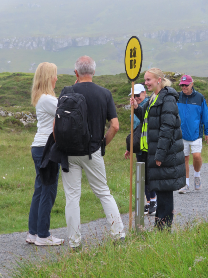 An 'ask me" information girl being interviewed at Runavik, Faroe Islands.