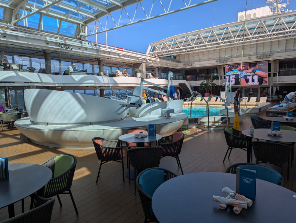 The midship indoor poor on the Holland America cruise ship Nieuw Statendam has a retractable roof for nice days.