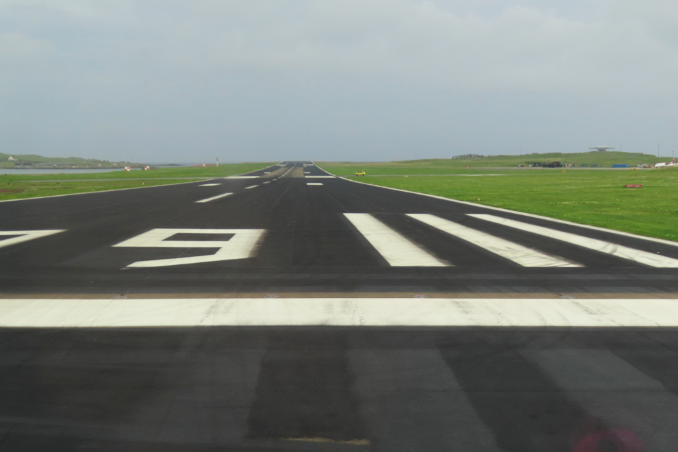 The highway crosses one of the two runways at Sumburgh Airport, Shetland.