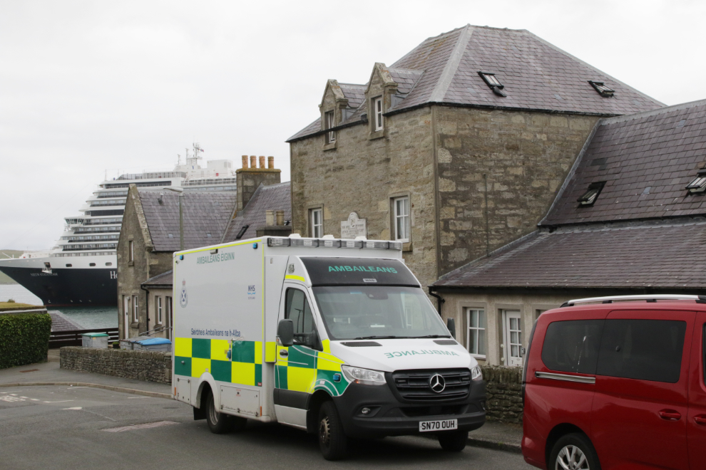 An ambulance in front of the historic Homes for Widows at Lerwick, Shetland.