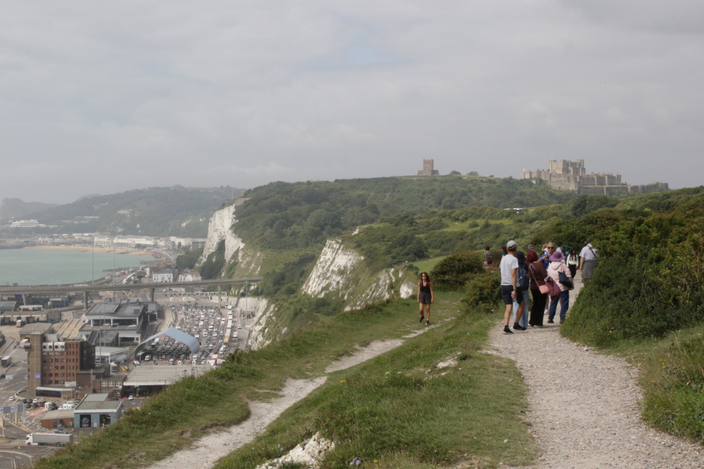 A trail along the white cliffs of Dover, England, with Dover Castle in the distance.