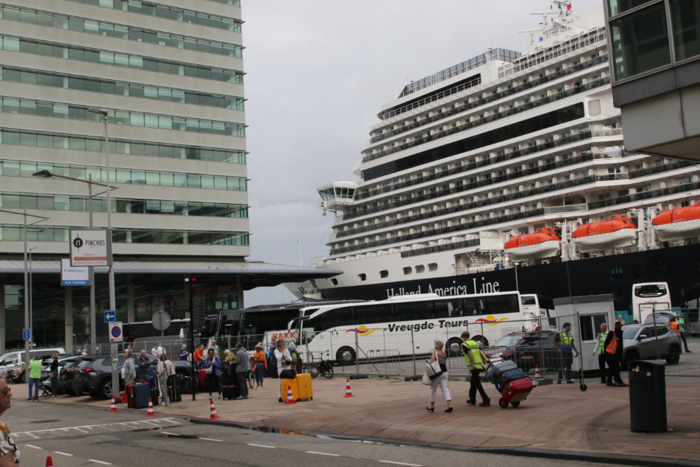 Busses at The Rotterdam Cruise Terminal, with the Holland America cruise ship Nieuw Statendam behind.